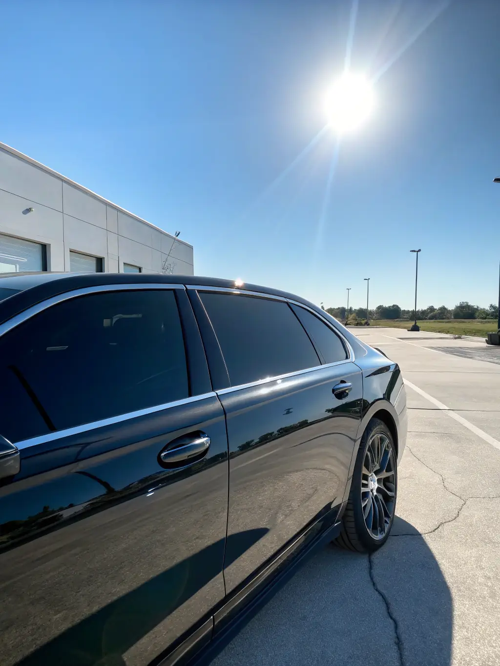 A sleek car with professionally tinted windows, highlighting the aesthetic appeal and stylish upgrade provided by Window Élite's services.
